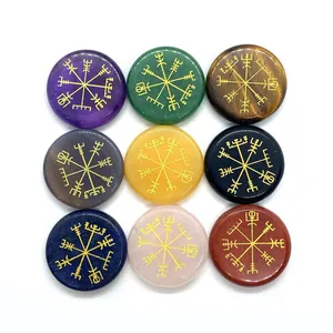 Polished flat round semi-precious stones with golden engraved Viking Vegvisir symbols