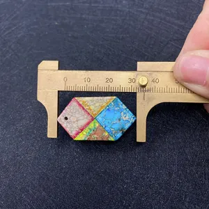Hexagonal multi-color emperor stone pendant with natural veining measuring 35mm