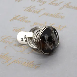 Handmade wire wrapped natural agate ring with irregular stone and size 16 label