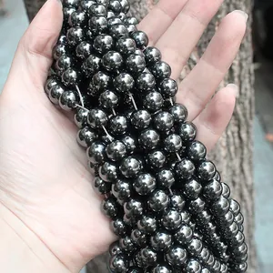 Cuentas redondas de hematita natural con brillo metálico para creación de joyería