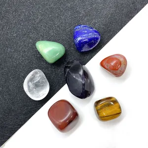7-piece set of polished natural chakra stones including tiger eye and lapis lazuli
