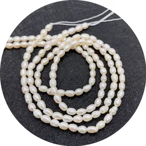 Brins de perles d'eau douce naturelles blanches en forme de riz pour création bijoux