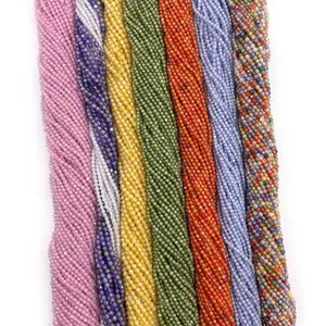 Macro view of multi-colored faceted round beads in seven shades for DIY jewelry making