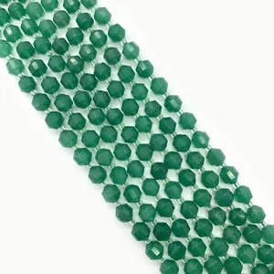 Macro view of faceted green gemstone beads for jewelry making with high gloss finish