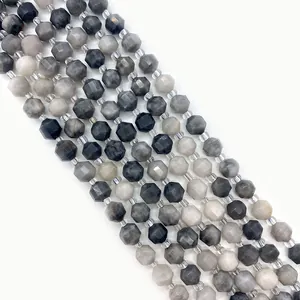 Macro view of faceted natural stone beads with detailed grey texture for DIY jewelry