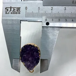 Macro shot measuring a 15mm teardrop amethyst druzy pendant with gold plating