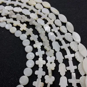 Natural mother of pearl shell beads in star and hamsa shapes for jewelry making