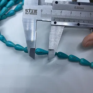 Mesure détaillée de perles turquoise en forme de goutte montrant 14mm pour bijoux DIY