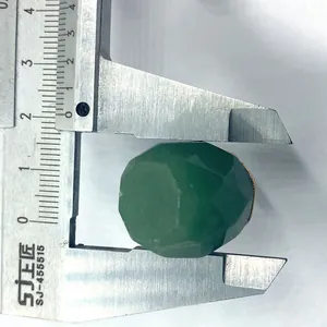 Macro view of 19mm green faceted natural stone pendant measured with a caliper