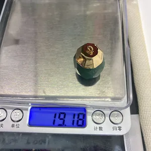 Green aventurine faceted cylinder pendant weighing 19.18g on a digital scale