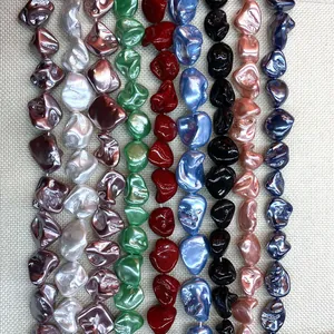 Close-up of irregular iridescent baroque-style loose beads in nine vibrant metallic colors