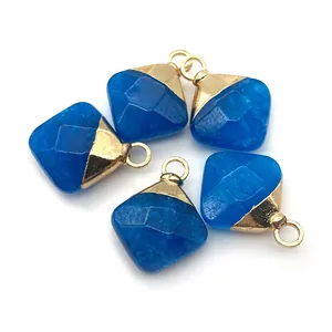 Detail showing five blue faceted diamond-shaped stone pendants with gold metal bail