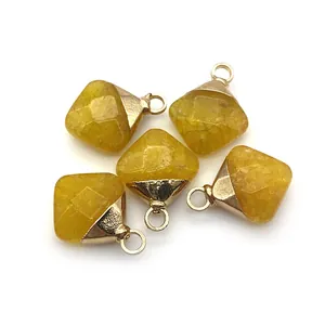 Detailed view of five diamond-cut yellow gemstone pendants with golden metal edges