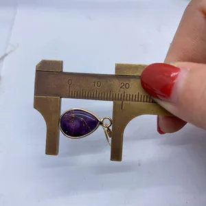 Detailed measurement of purple drop-shaped stone earrings with gold metal frame