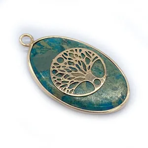 Natural blue stone oval pendant with gold tree of life metal overlay and polished frame