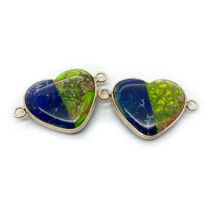 Macro detail of heart-shaped imperial stone connectors with gold edges for jewelry DIY
