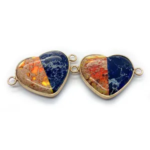 Close-up of heart-shaped natural stone connectors with gold edges for DIY jewelry making