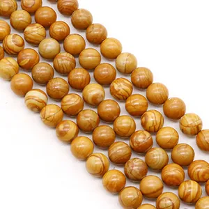 Close-up of polished natural wood grain stone beads for DIY jewelry making