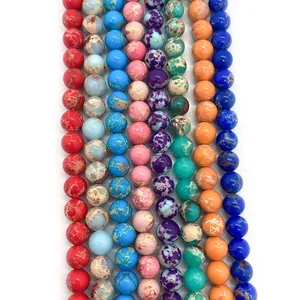 Close-up of colorful round imperial jasper stone beads for DIY jewelry making