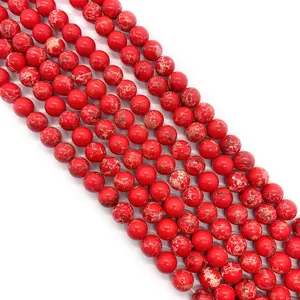 Macro detail of red imperial stone beads with natural marble texture for DIY jewelry
