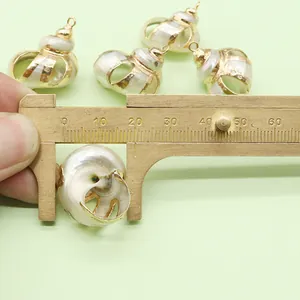 Detailed dimension measurement of natural shell conch pendant with golden metal frame