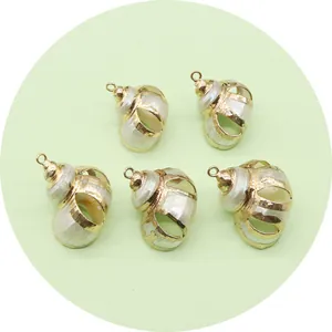 Five pieces of natural shell pendants with golden hollow metal frames and bead textures