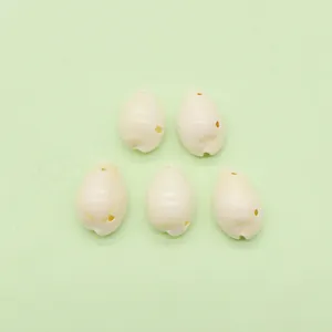 Set of five natural cream cowrie shells with pre-drilled holes for DIY jewelry making