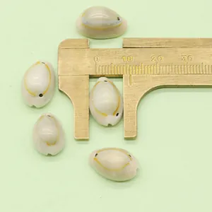 Macro view of 10mm natural cowrie shells with yellow rings for DIY jewelry making