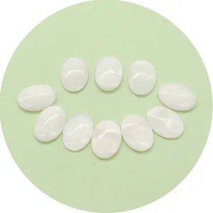 Set of 10 oval white mother of pearl shell cabochons with natural iridescent luster