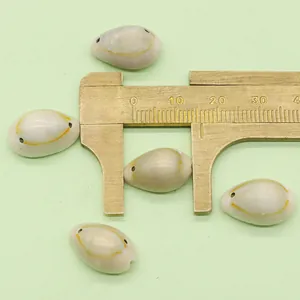 Macro view of 20mm natural cowrie shells with yellow rings for DIY jewelry making
