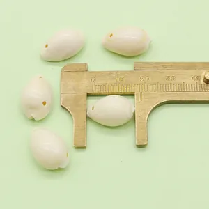 Caliper measuring a 16mm white natural shell bead for DIY necklace making