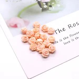 Detailed view of pink rose-shaped coral beads for handmade DIY jewelry accessories