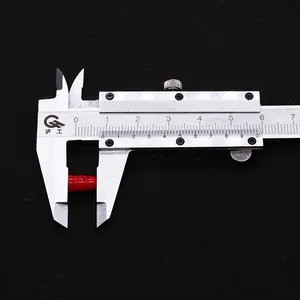 Detailed measurement of red coral gourd bead showing 7mm length with a silver caliper