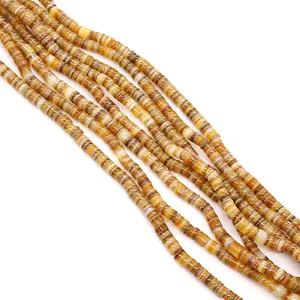 Macro shot of colorful cylindrical Heishi beads with natural texture for DIY jewelry making