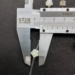 Macro shot measuring 10mm white mother of pearl shell rose bead with a caliper