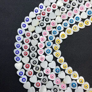 Natural heart-shaped seashell beads with colorful evil eye inlay for DIY jewelry making