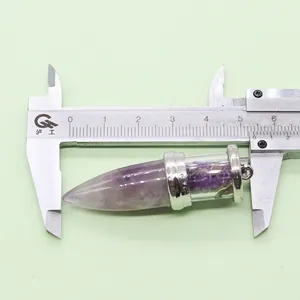 Macro detail of purple crystal bullet pendant showing a length of 55mm on a caliper
