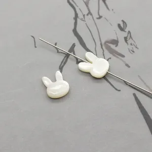 Macro view of rabbit-shaped mother of pearl beads for DIY jewelry and necklaces