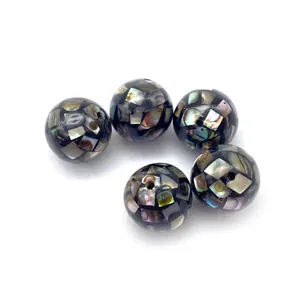 Macro view of natural mosaic abalone shell inlay beads for DIY jewelry making