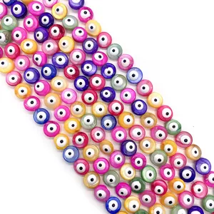 Macro shot of colorful shell Evil Eye beads for DIY jewelry making neatly arranged