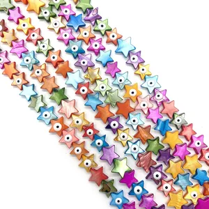 Detailed view of star-shaped shell beads with evil eye pattern for DIY jewelry