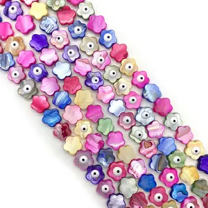 Macro shot of colorful plum blossom sea shell evil eye beads for DIY jewelry making