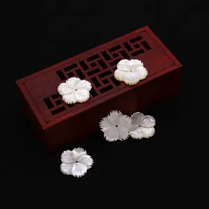 Five carved mother of pearl flower pendants with natural iridescent luster for DIY jewelry