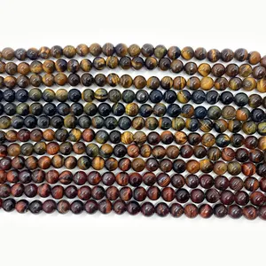 Macro detail of polished tiger eye natural stone beads in brown blue and red hues