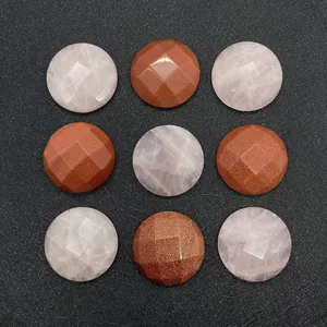 Macro display of 25mm faceted rose quartz and gold sandstone round cabochon stones