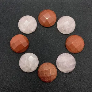 Detailed macro view of 25mm round faceted rose quartz and goldstone cabochons