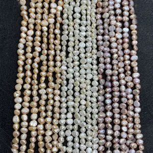 Macro detail of natural freshwater baroque pearls in white pink and purple for DIY jewelry