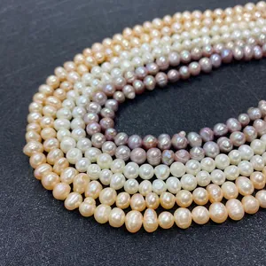 Close-up of multi-colored natural freshwater pearls with visible growth texture and luster