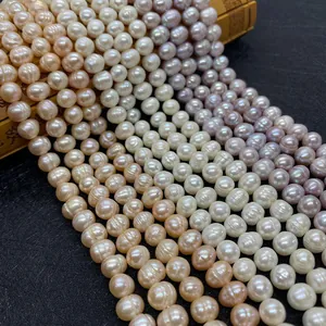Detailed view of multi-colored 8-10mm freshwater pearl strands on a dark background