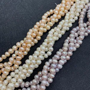 Macro shot of natural freshwater pearls in cream, pink, and purple with high luster